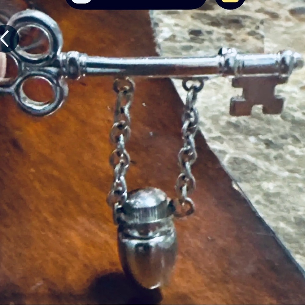 Elegant Silver Key Brooch